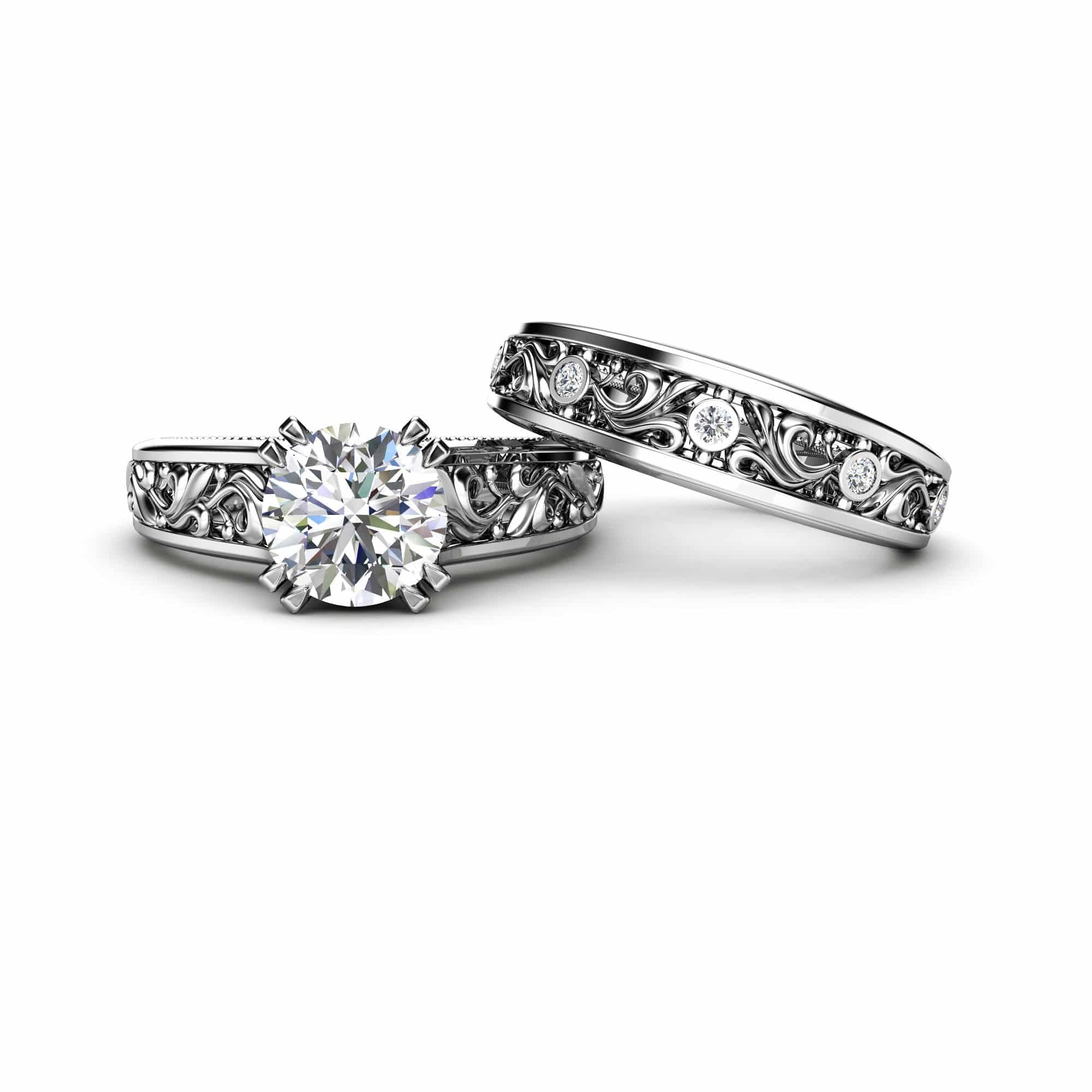 Close up of a brilliant round moissanite center stone in a crown-style filigree basket.