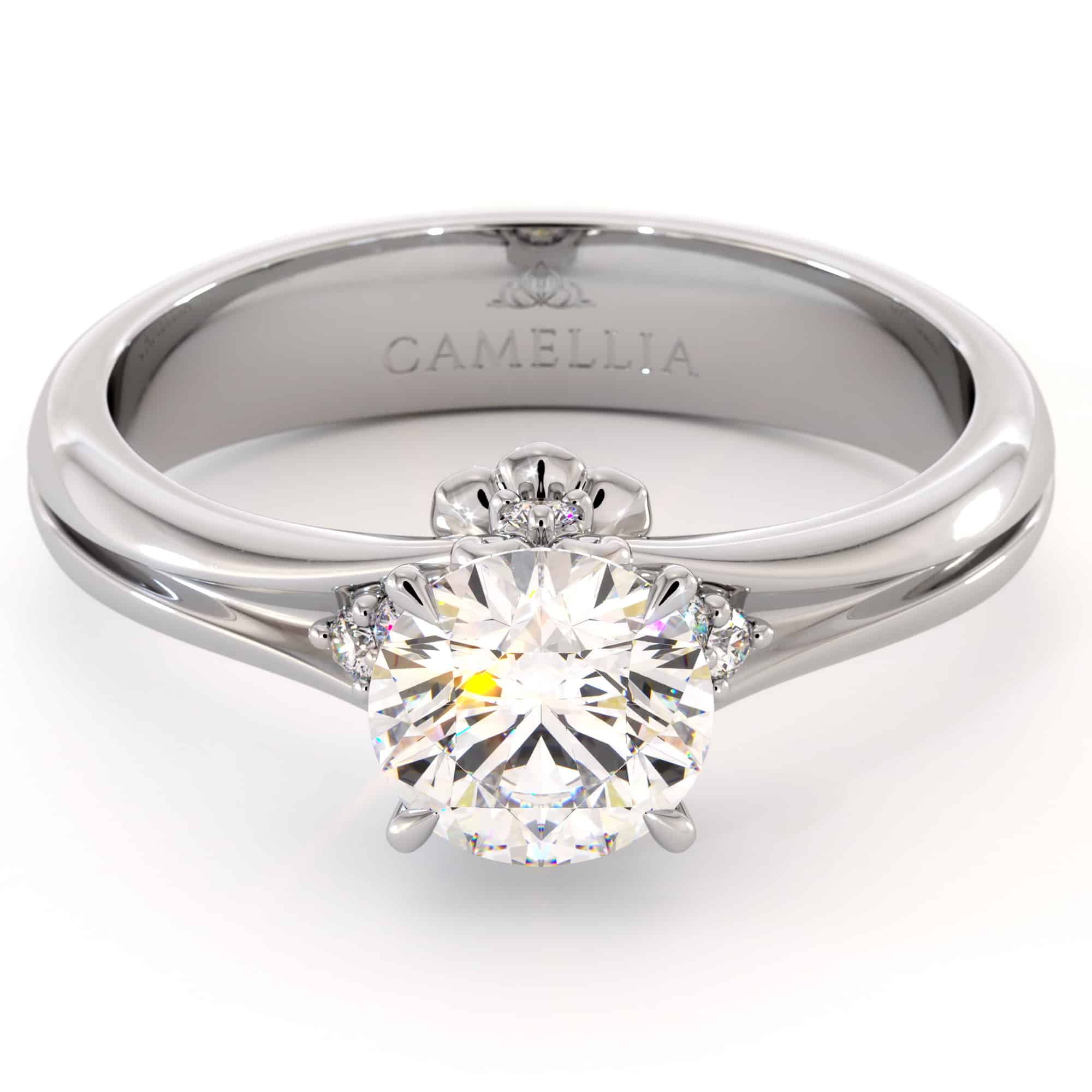 CL-0007A — White Gold, three-quarter view Three-quarter view of the white gold solitaire, a round moissanite raised above a hidden heart-shaped gallery