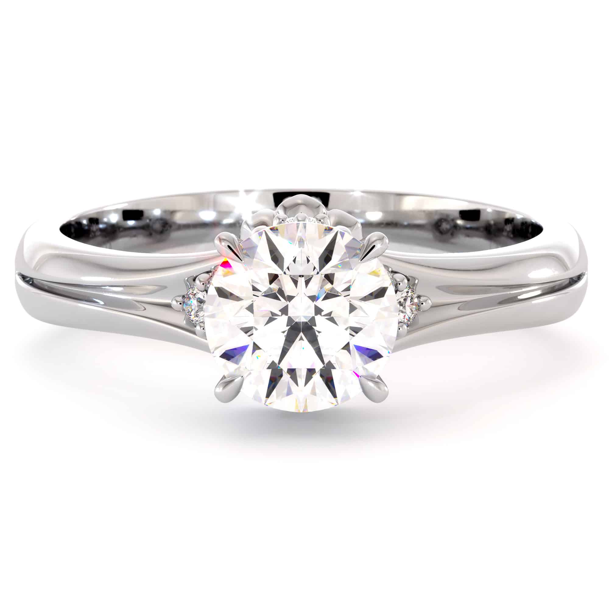 CL-0007A — White Gold, face-up view Round moissanite face-up in white gold, six claws holding the stone above a heart motif underneath