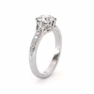 Round Moissanite Engagement Ring with Diamond Band and Petal-Inspired Gallery