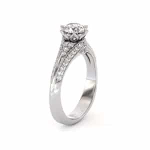 Ornate Pavé Solitaire Ring With Petal-Inspired Crown And Side Diamonds