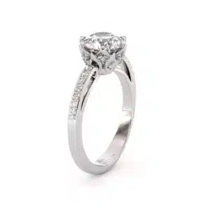 Round Moissanite Engagement Ring with Pavé Diamond Band and Elegant Gallery