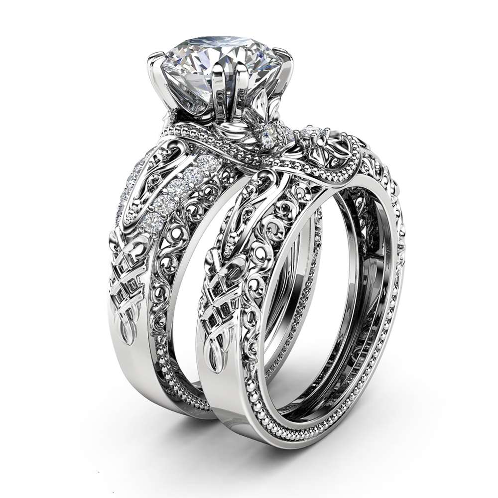 Angled View Art Deco Round Diamond Bridal Set An angled view of an Art Deco bridal set featuring a 2ct round diamond and intricate filigree bands.