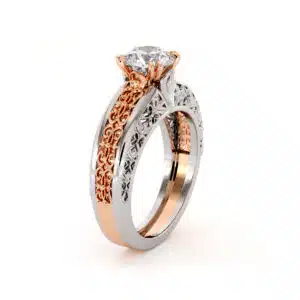 Side angle of the two-tone solitaire, showing the depth of the pierced rose gold panel