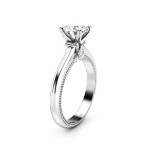 Direct frontal view of a 1-carat round lab diamond engagement ring with side accents.