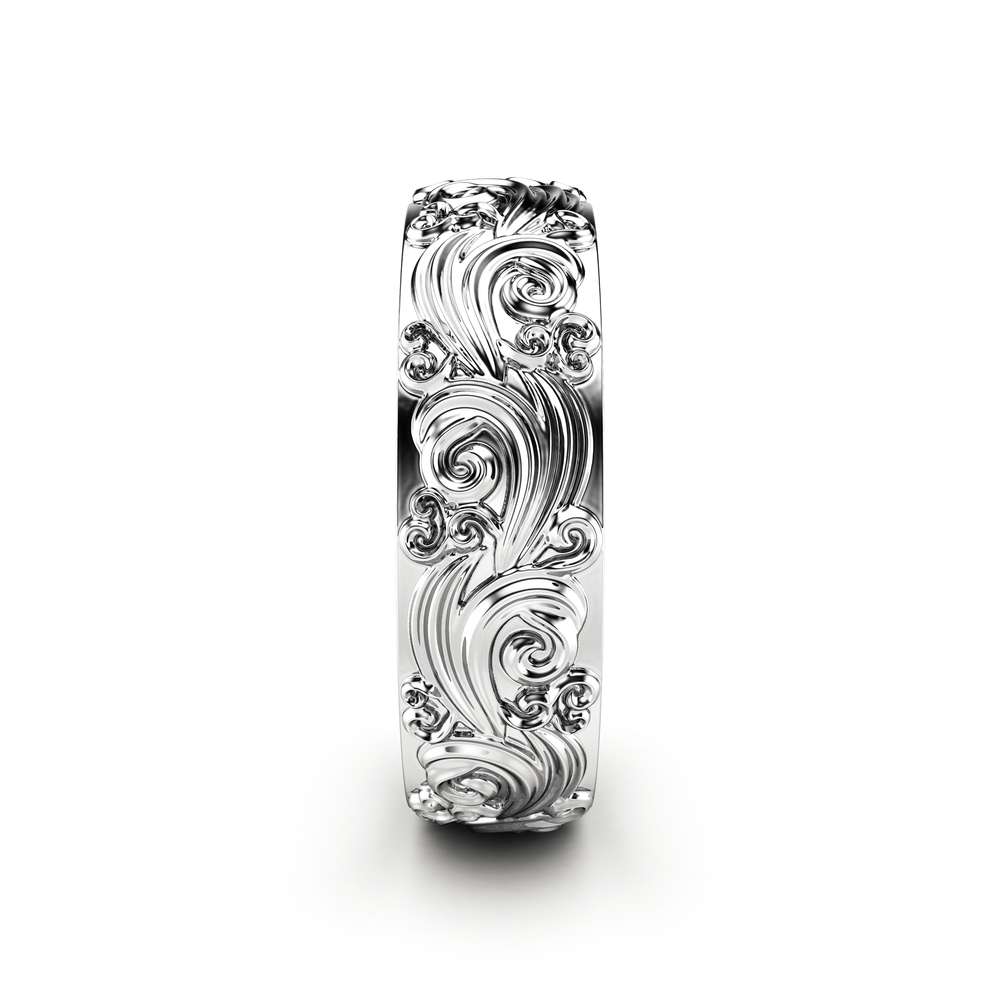 RM-0025A — White Gold, side profile Side profile of the white gold carved band, scroll relief running edge to edge around the shank