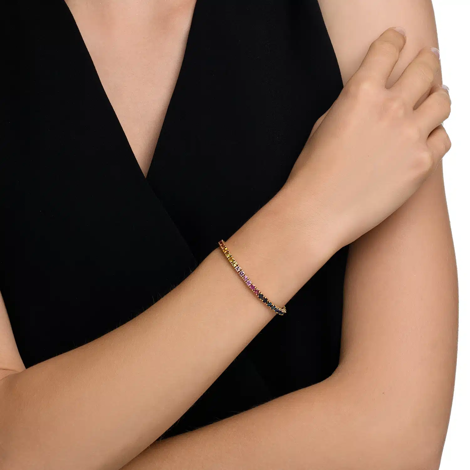 HS-0010A 14K Rose Gold Rainbow Tennis Bracelet on Wrist – Elegant & Colorful Jewelry 14K rose gold rainbow tennis bracelet with vibrant multicolored gemstones, elegantly worn on the wrist.