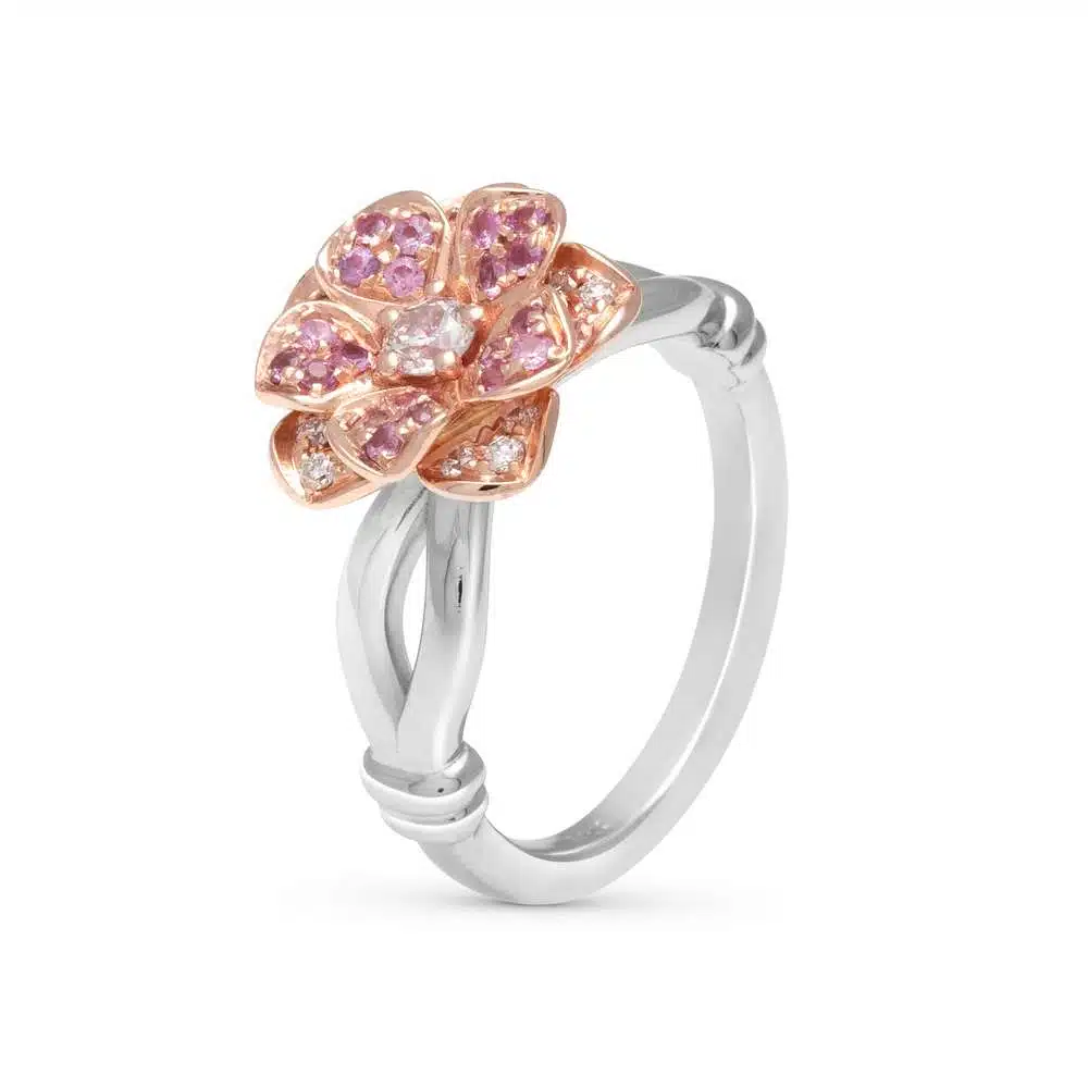 SF-0009A — White and Yellow Gold, three-quarter view Two-tone daisy ring at three-quarter angle, a yellow gold pave bloom raised on a split white gold shank