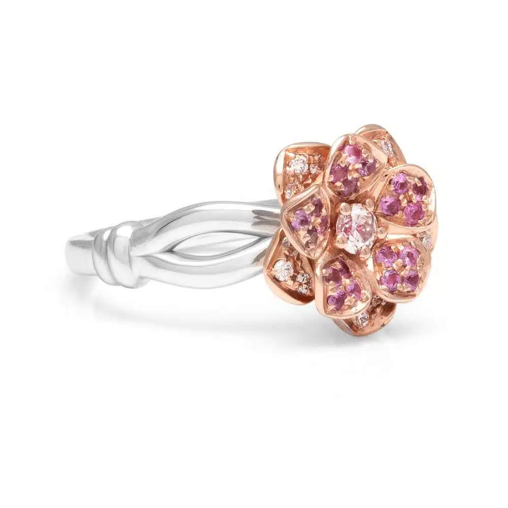 SF-0009A — White and Yellow Gold, angled view Two-tone daisy ring seen at an angle, seven pave-set yellow gold petals around a round diamond centre