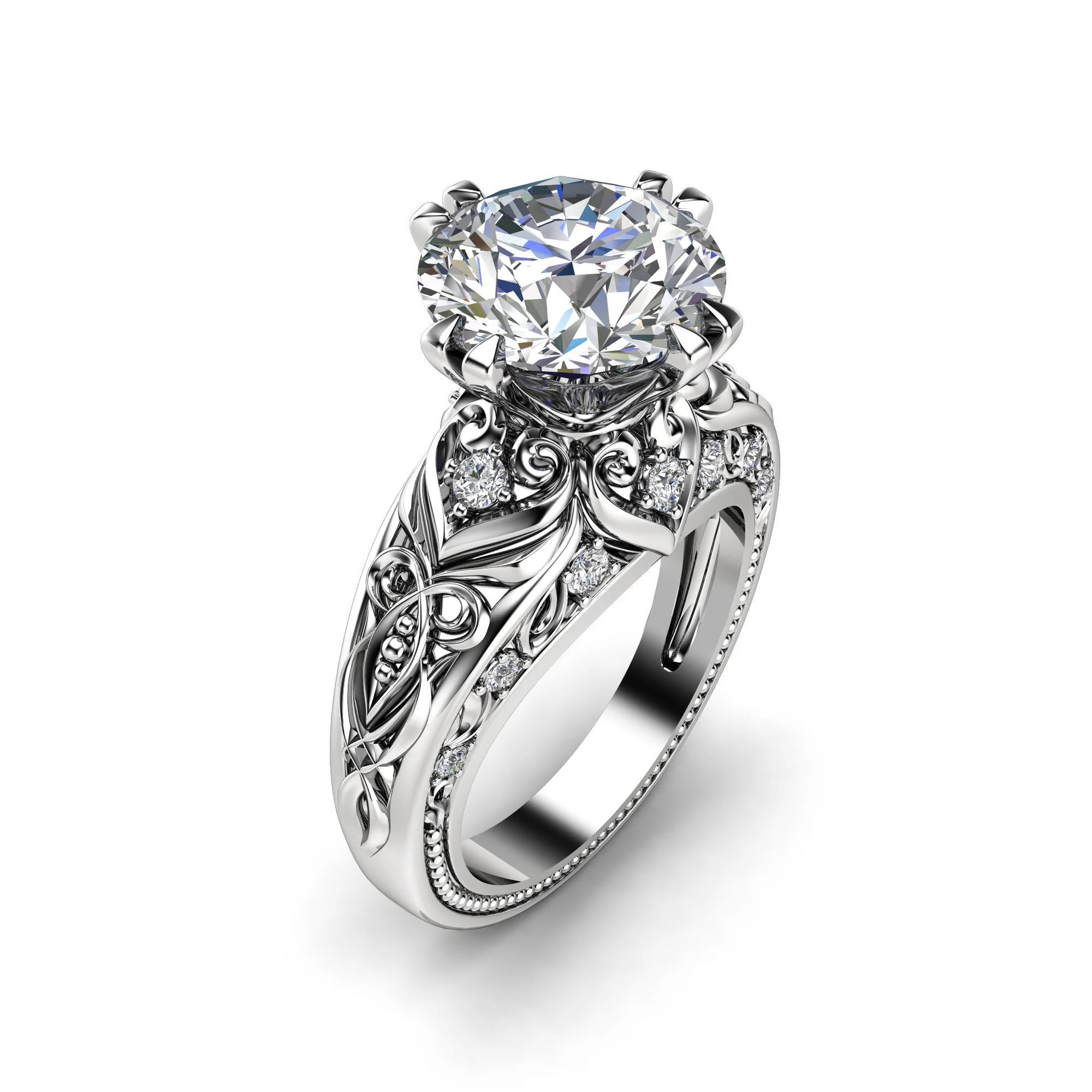 1786996807299-hqxesl.webp Close three-quarter view of a white gold round diamond ring with pave accents set into the filigree