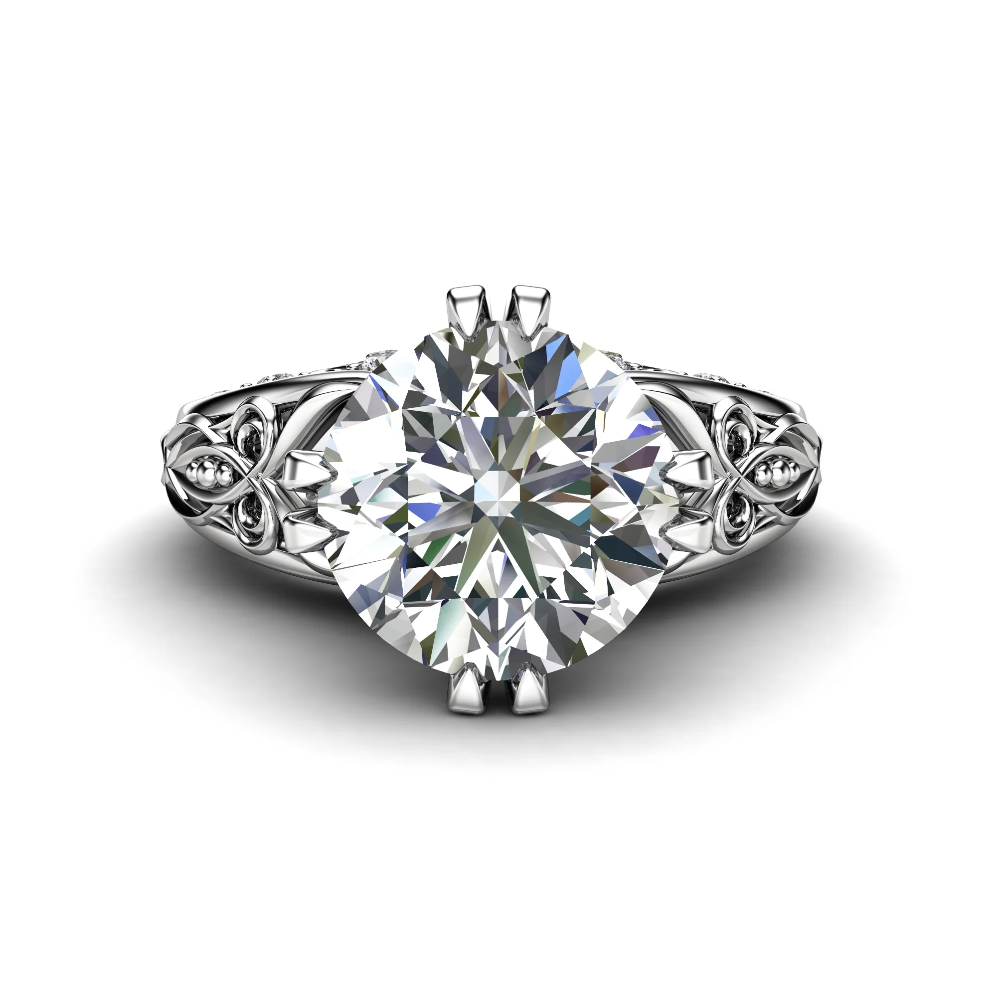 1786996813364-xv1zdr.webp Face-up view of a round brilliant diamond in a white gold setting with scrolled, pierced shoulders