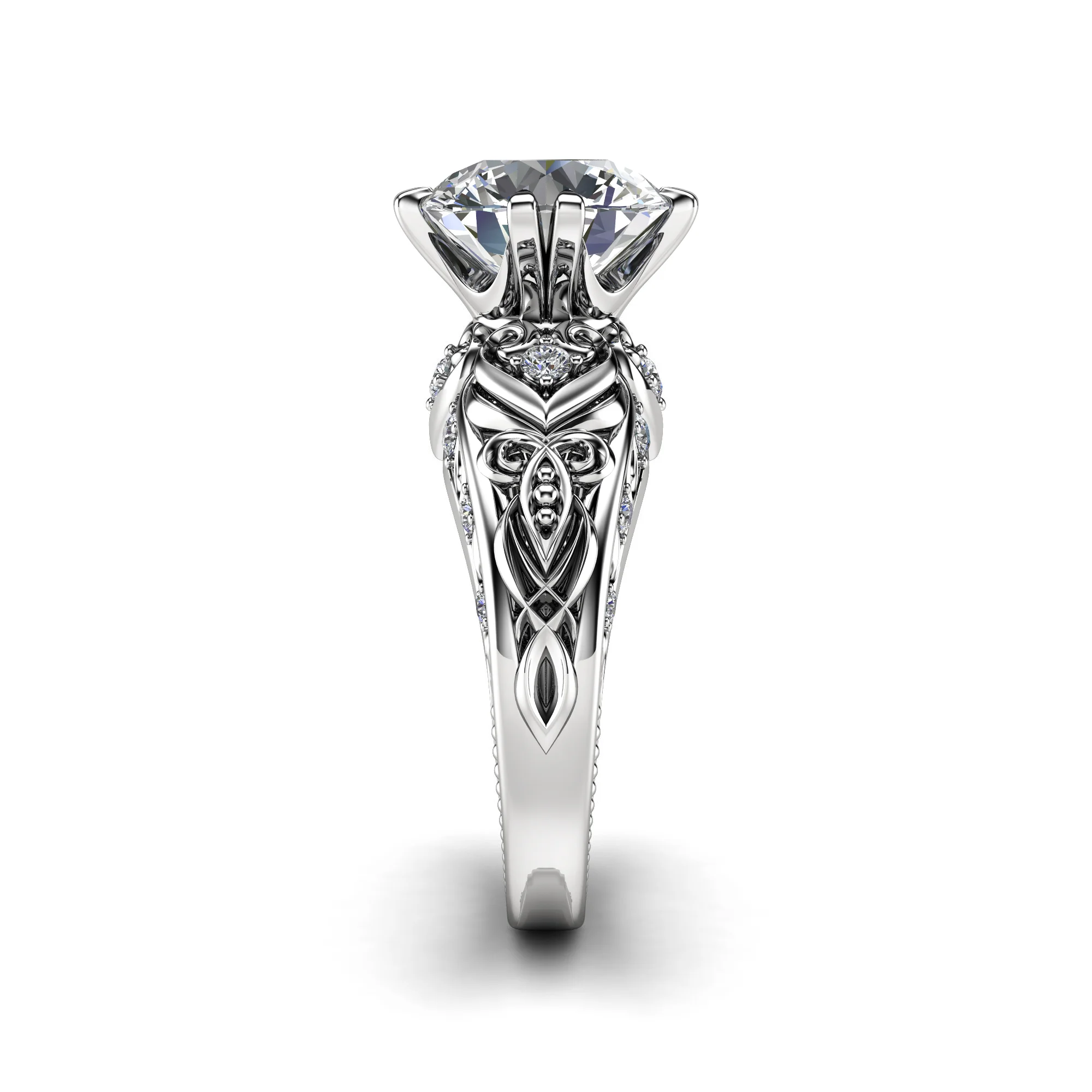 1786996815915-zjmsfj.webp Front elevation of a white gold round diamond ring, showing the pierced filigree gallery beneath the center stone